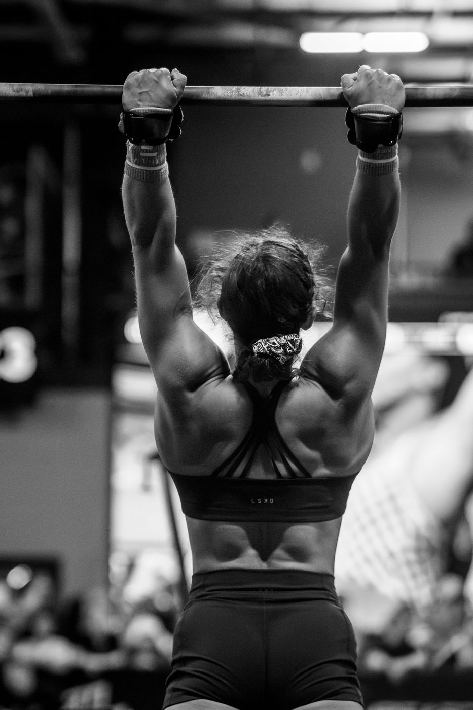 Athlete on the pull-up bar, black and white